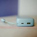 Close-up of Baseus FC11 built-in Type-C and Lightning cables