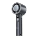 Person using Hoco HX612 handheld fan outdoors