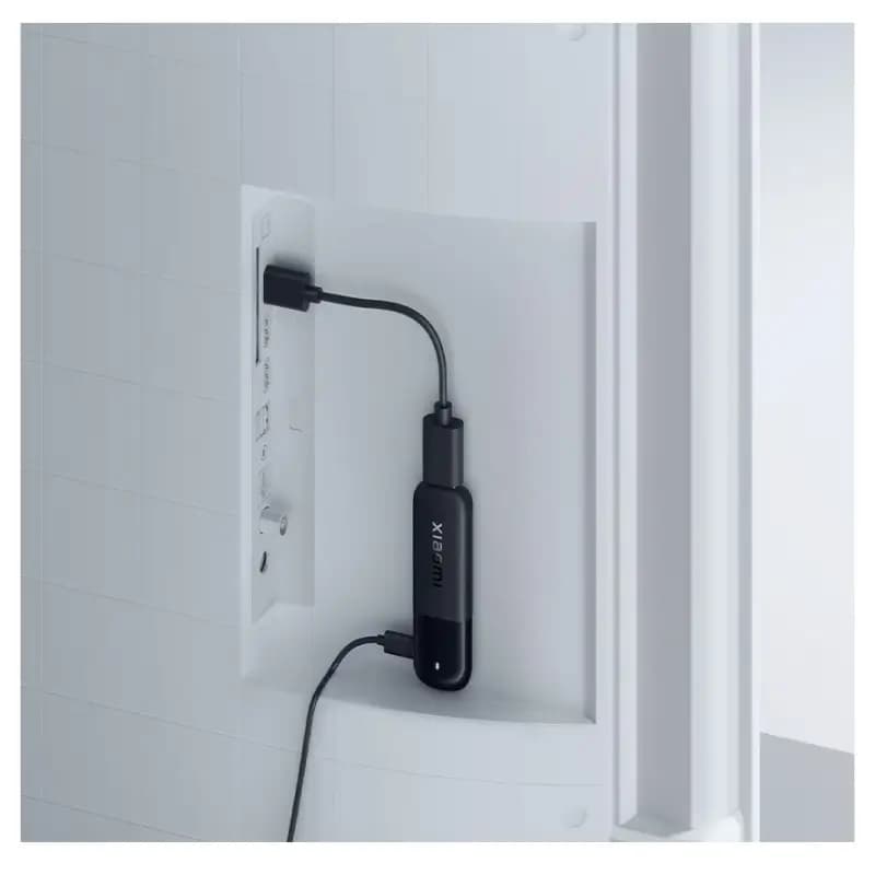 Xiaomi TV Stick HD 2nd Gen plugged into a television HDMI port Xiaomi TV Stick HD 2nd Gen plugged into a television HDMI port