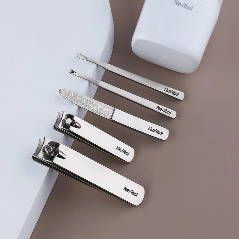 Xiaomi Nextool NE20015 Zhizhen Nail Clipper Set:
Features:
Introducing the Xiaomi Nextool NE20015 Zhizhen Nail Clipper Set, a must-have addition to your household for impeccable nail care. Crafted with precision from high-quality steel, this five-piece set is designed to provide the ultimate in nail grooming and maintenance.
Superior Durability and Toughness: Crafted from steel renowned for its strength and durability, this nail clipper set is built to last. Its high toughness ensures that these tools can withstand regular use without losing their edge.
Comprehensive Nail Care: This set includes five essential tools, covering all your nail care needs. From the nail clipper and toenail knife for precise trimming to the nail file for shaping and smoothing, every tool is designed for optimal performance. Additionally, the set includes a dead skin push and an ear scoop.
Sharp and Reliable: The cutting edge of each tool is meticulously sharpened, and then hardened through a rigorous grinding and hardening process. This ensures that the tools remain consistently sharp, making it easy to trim even thick nails with precision. The flat opening design further enhances its usability.